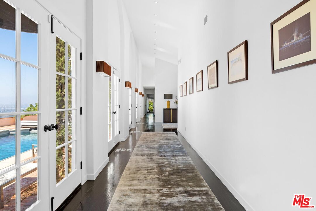 8663 Edwin Drive Los Angeles, CA 90046 - Photo 6 of 11 a view of a hallway with windows