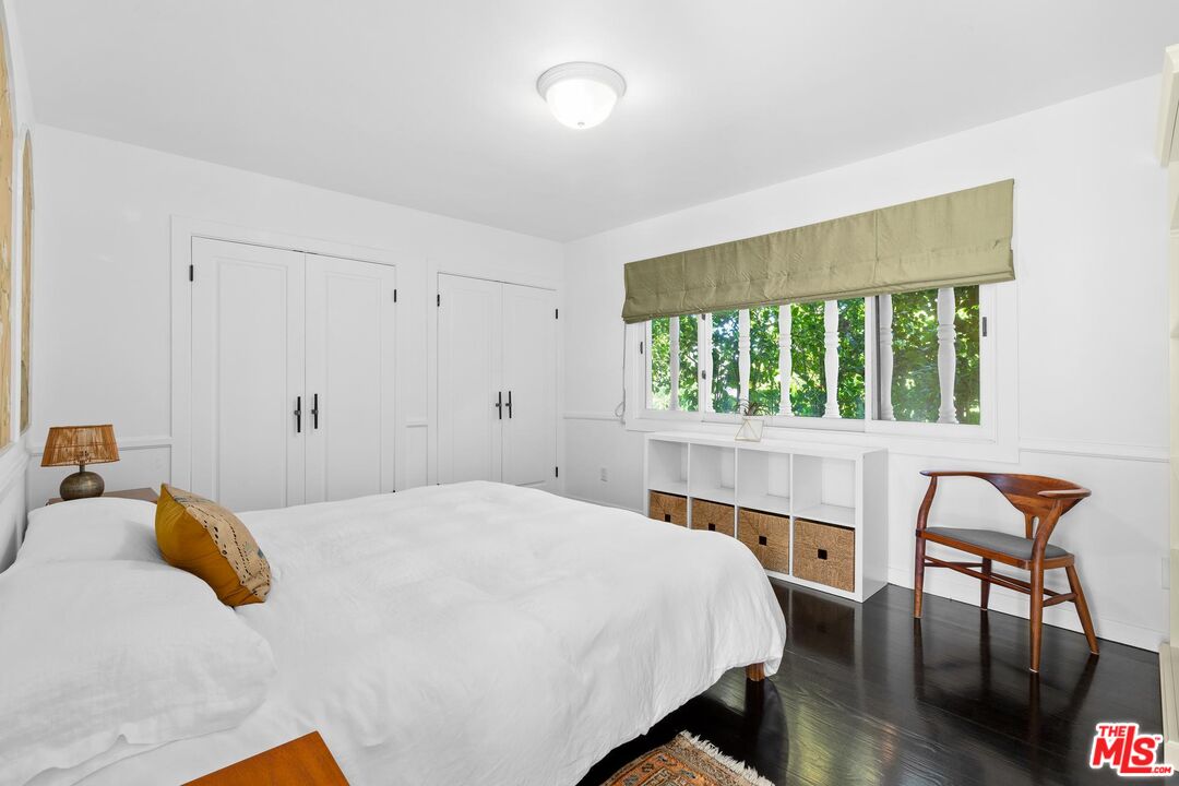 8663 Edwin Drive Los Angeles, CA 90046 - Photo 8 of 11 a bedroom with a bed and a window