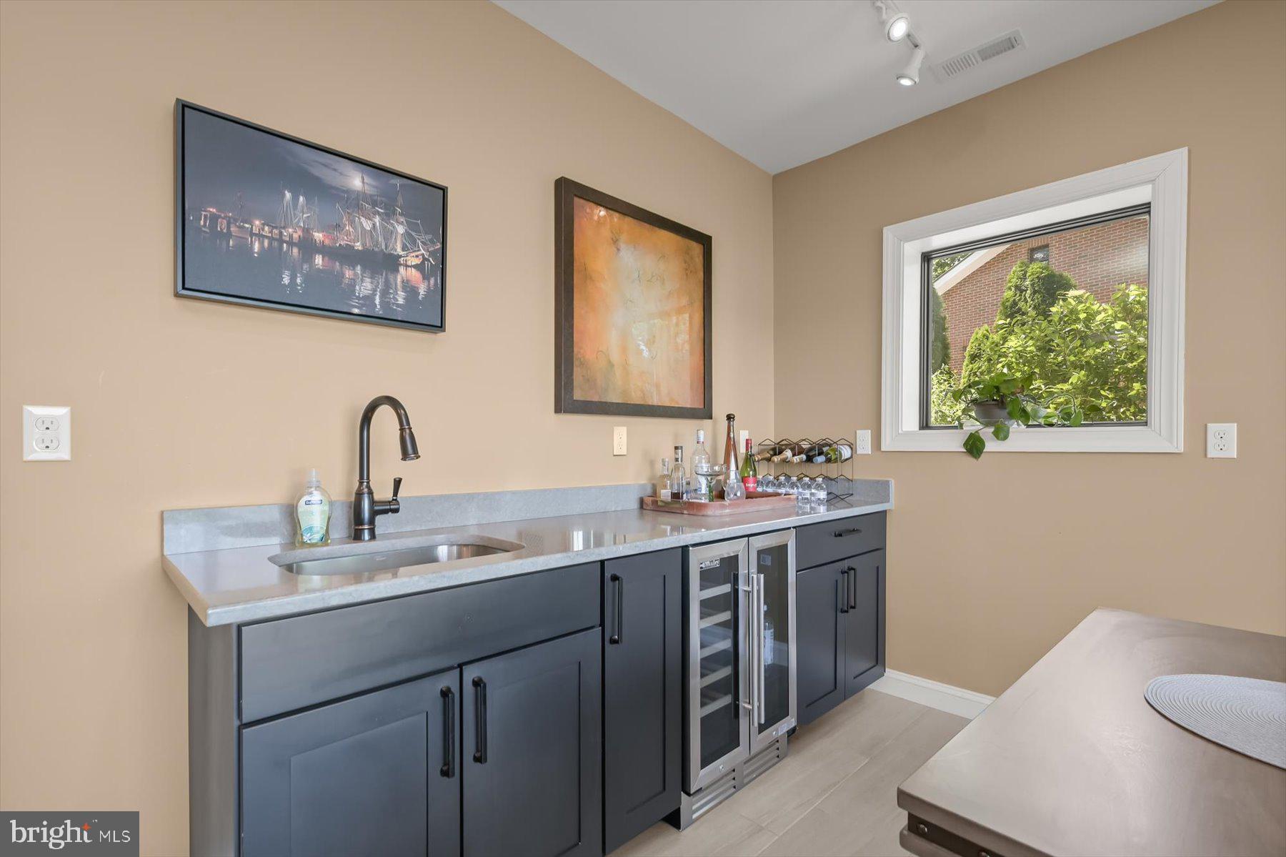 20 Shore Walk Road Riva, MD 21140 - Photo 54 of 71 Wet bar with wine fridge, sink and cabinetry