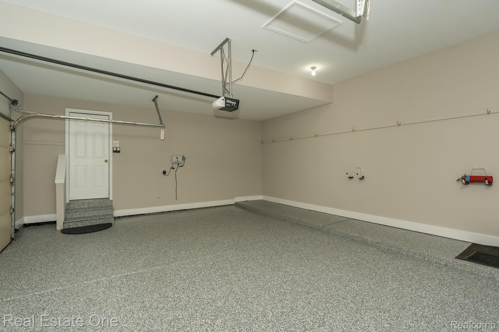 851 Loggers Circle Rochester, MI 48307 - Photo 33 of 40 FRESHLY PAINTED 3-CAR GARAGE WITH FRESH EPOXY FLOOR!! - 851 Loggers Circle