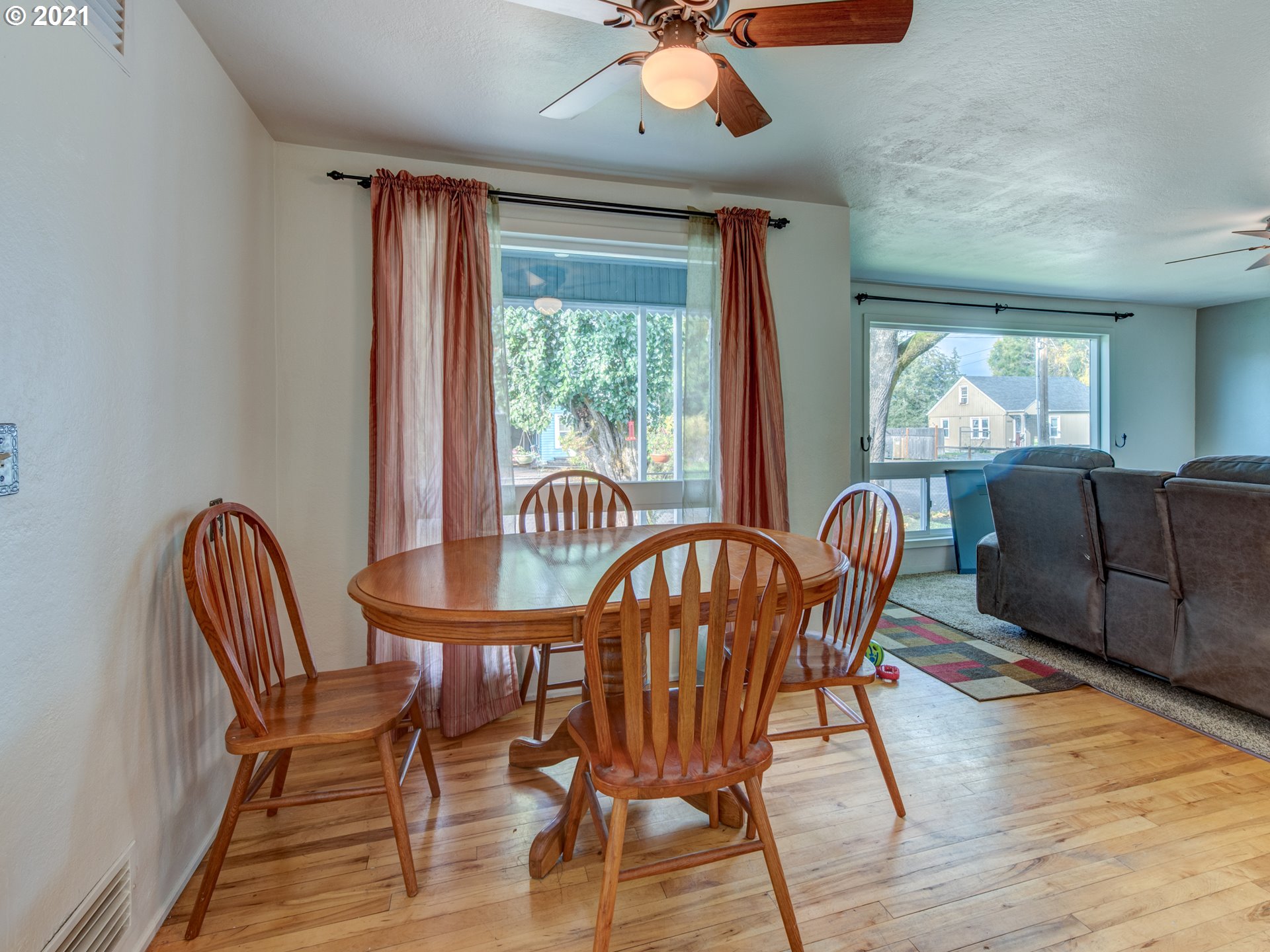1393 8th Street Springfield, OR 97477 - Photo 11 of 23 a view of a dining room with furniture window and wooden floor