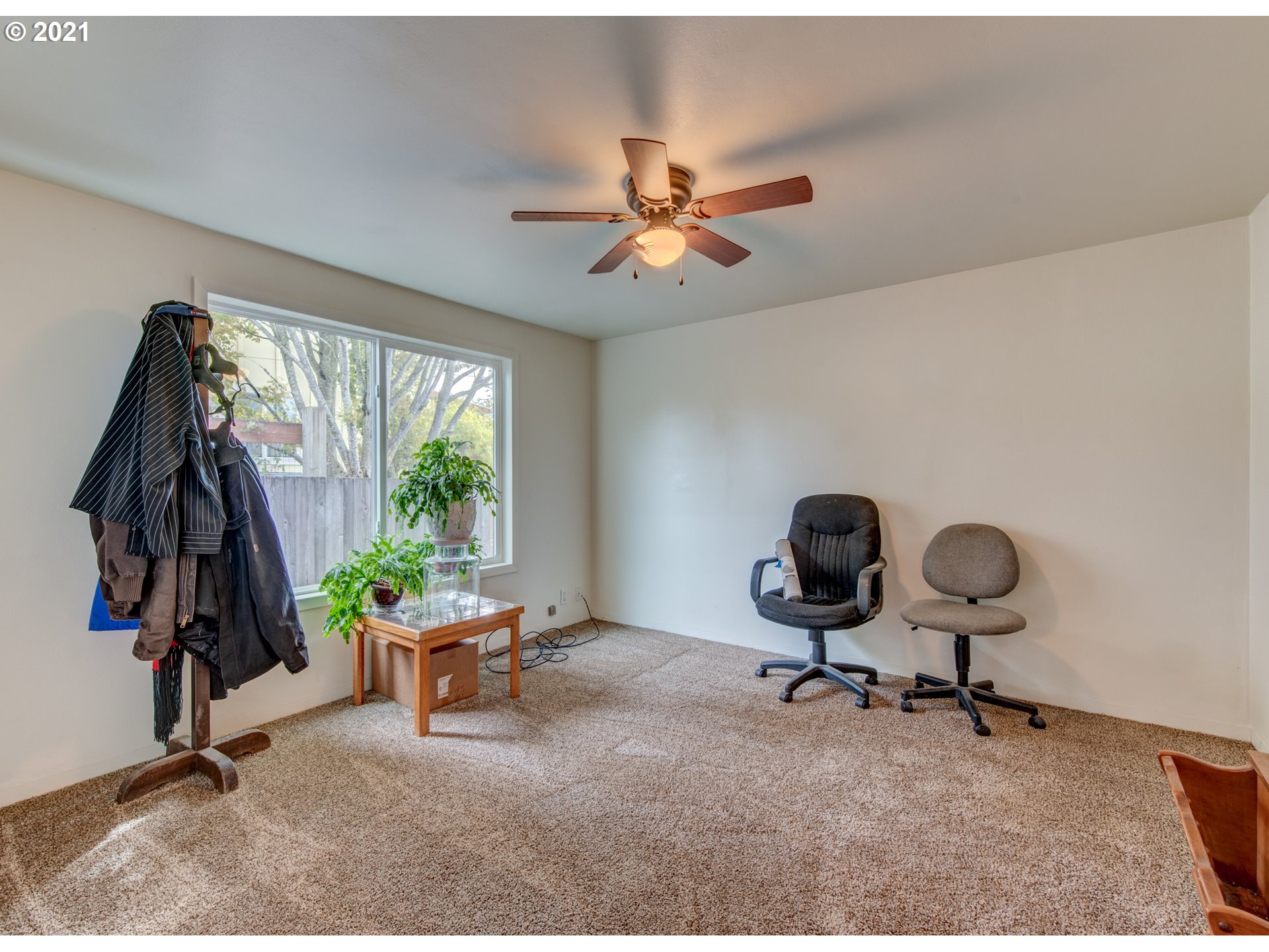 1393 8th Street Springfield, OR 97477 - Photo 17 of 23 a view of a workspace with furniture and a window