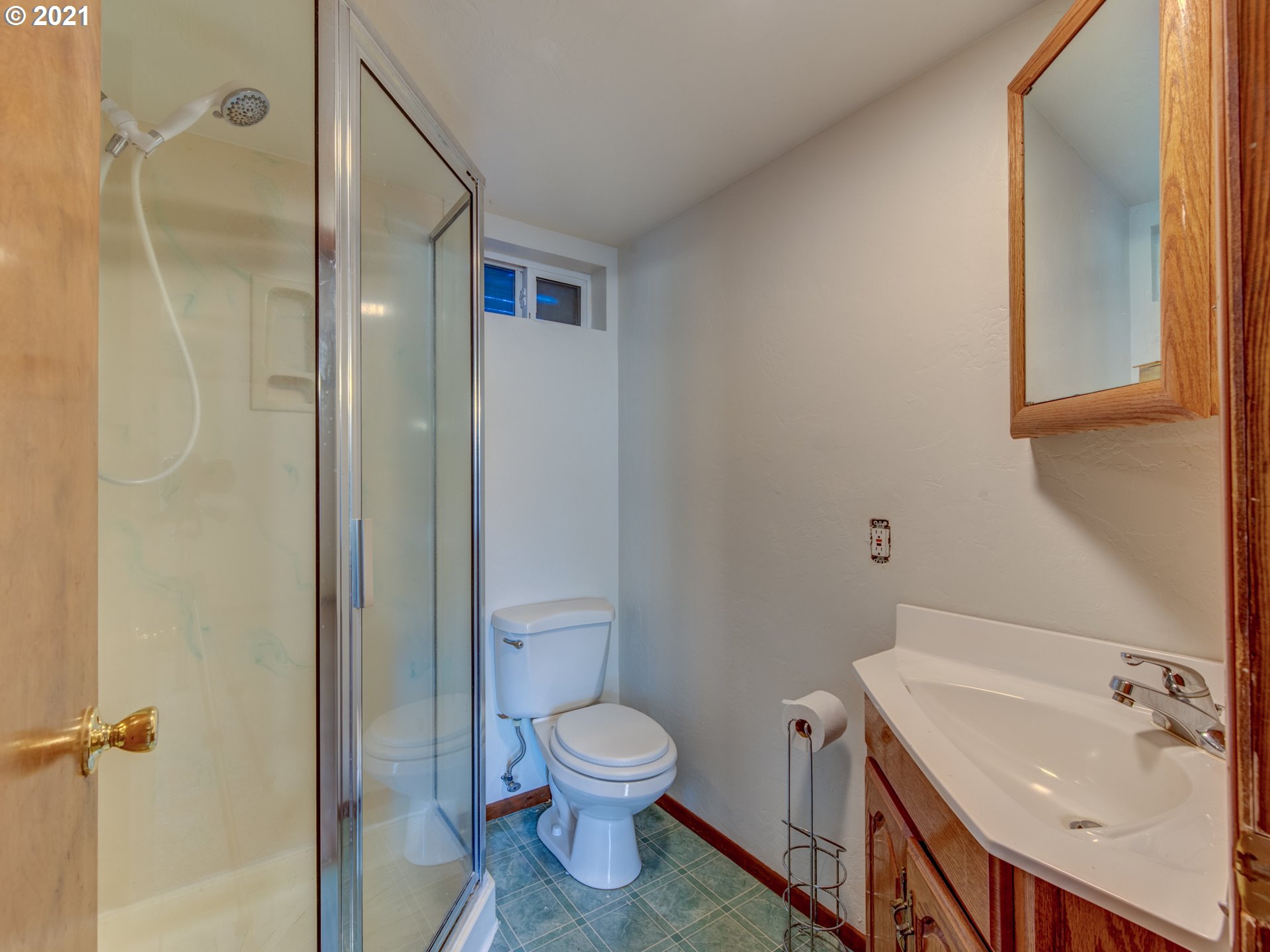1393 8th Street Springfield, OR 97477 - Photo 18 of 23 a bathroom with a sink toilet and shower