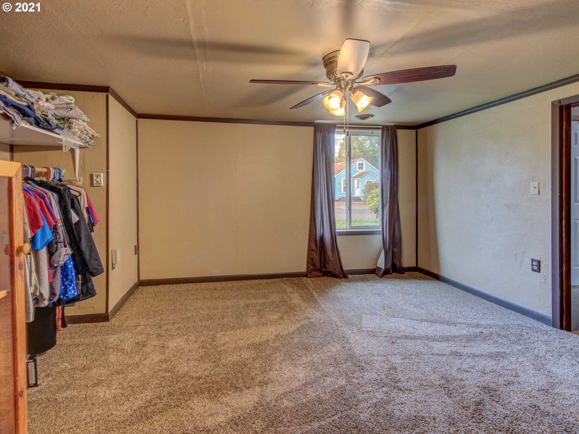 1393 8th Street Springfield, OR 97477 - Photo 19 of 23 a view of a hallway with a chandelier