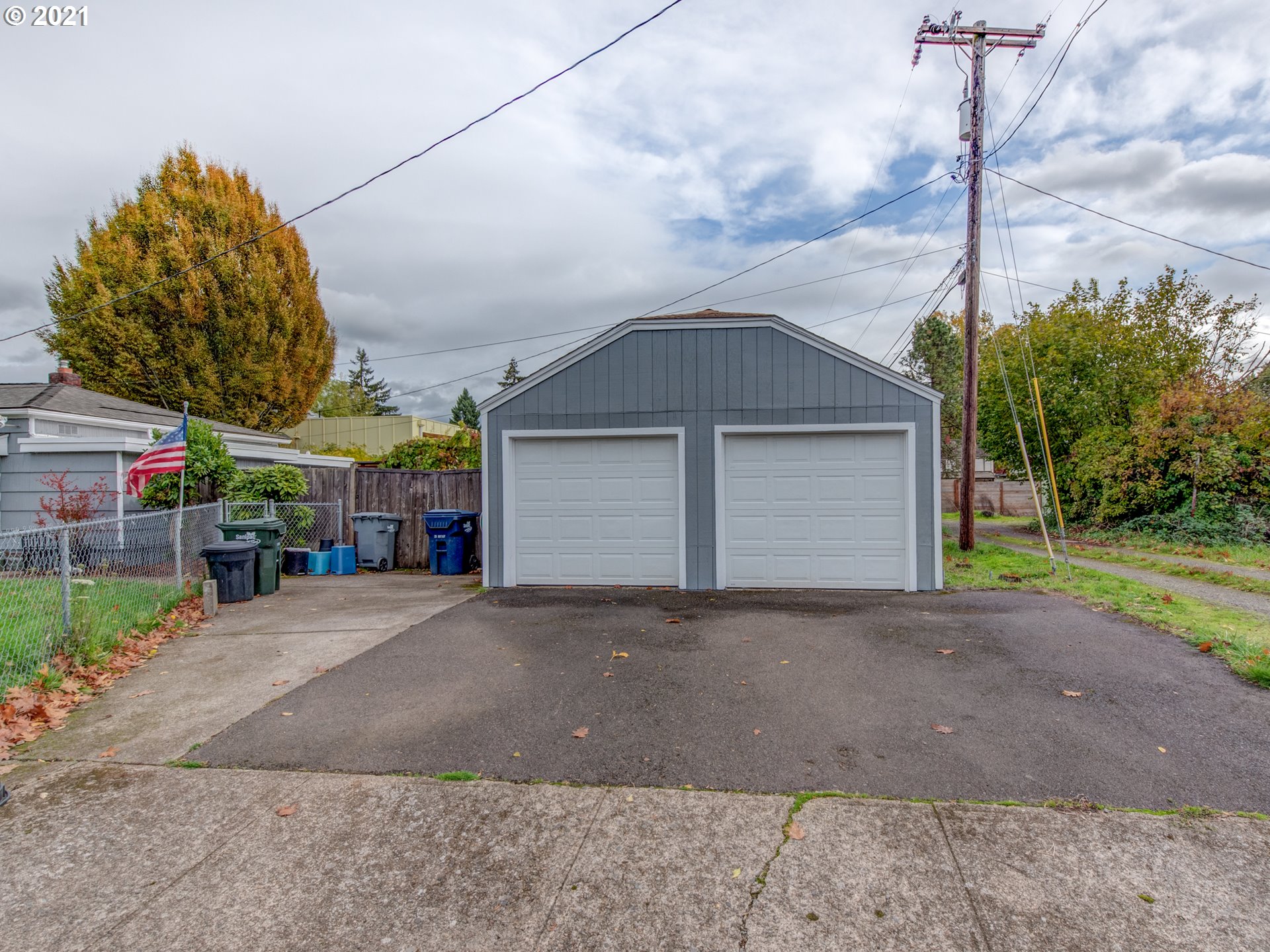 1393 8th Street Springfield, OR 97477 - Photo 20 of 23 a front view of a house with a yard and garage
