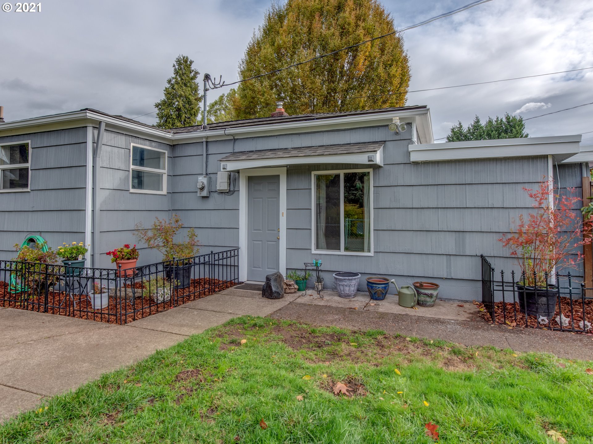 1393 8th Street Springfield, OR 97477 - Photo 3 of 23 a front view of a house with patio