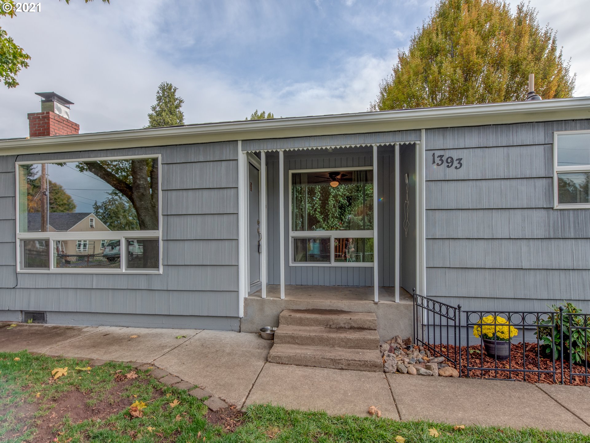 1393 8th Street Springfield, OR 97477 - Photo 21 of 23 a front view of a house with a garden