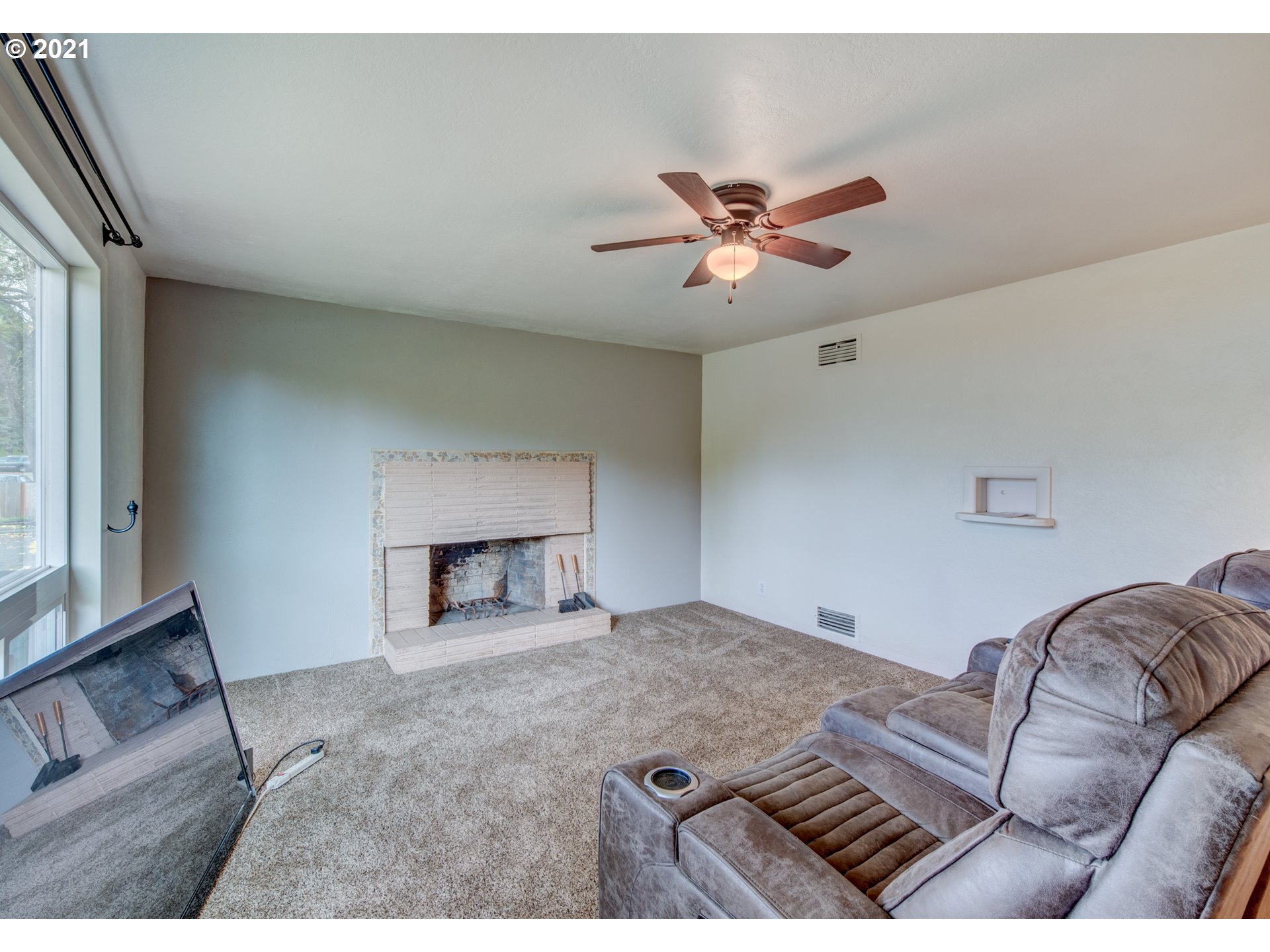 1393 8th Street Springfield, OR 97477 - Photo 5 of 23 a living room with furniture and a fireplace