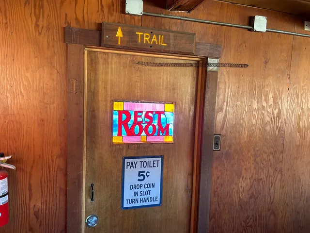 a kitchen with stainless steel appliances a stove and cabinets