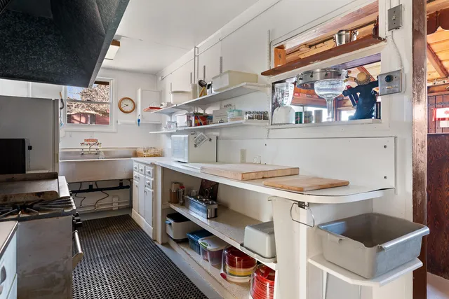 a view of front door of house and dining room
