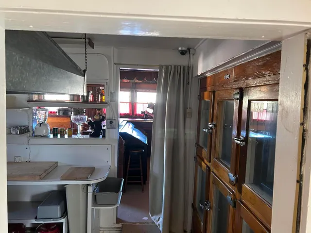 a view of a hallway with furniture and front door