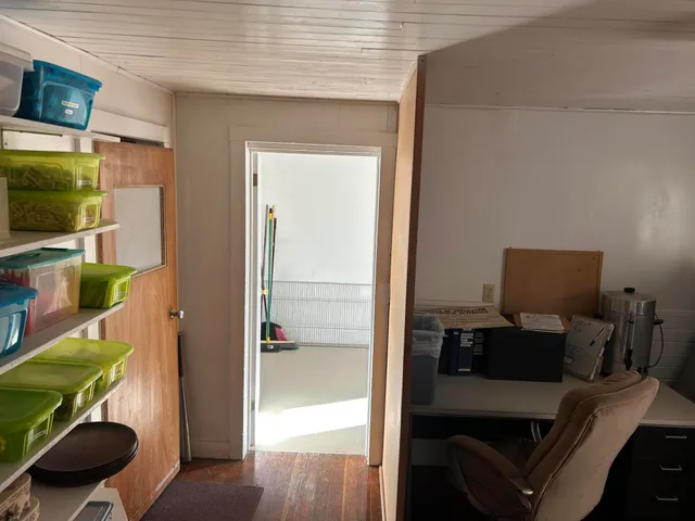 a view of a house with snow on the road