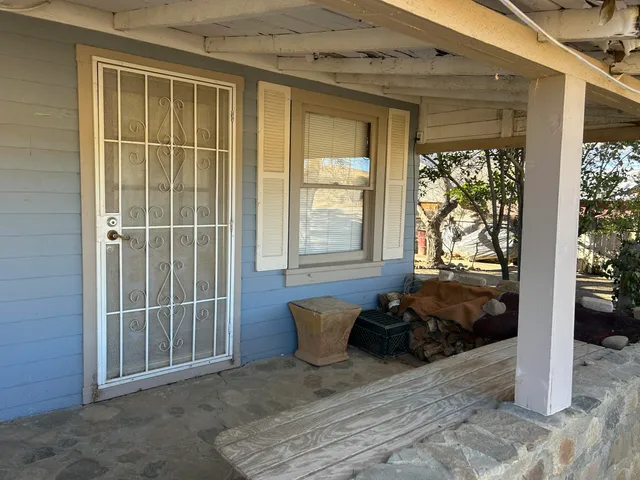 a kitchen with a sink appliances cabinets and furniture
