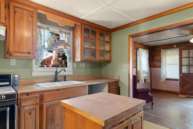 a view of a room with wooden walls