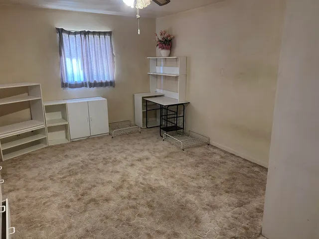 a view of a yard with snow on the road