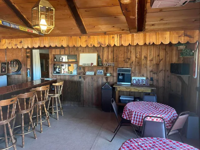 a room with pool table and furniture