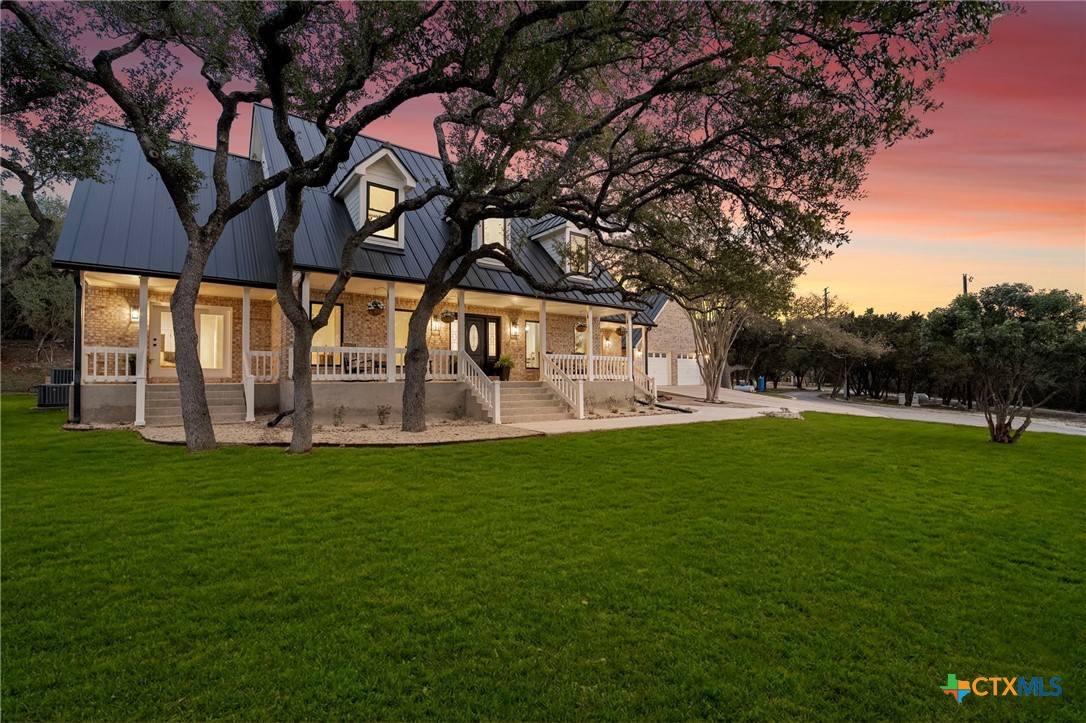 1130 Stoney Ridge Road Bulverde, TX 78163 - Photo 1 of 42 a view of building with a garden
