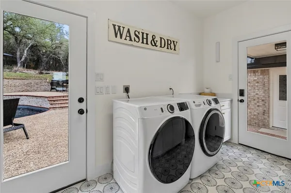 a utility room with dryer and washer