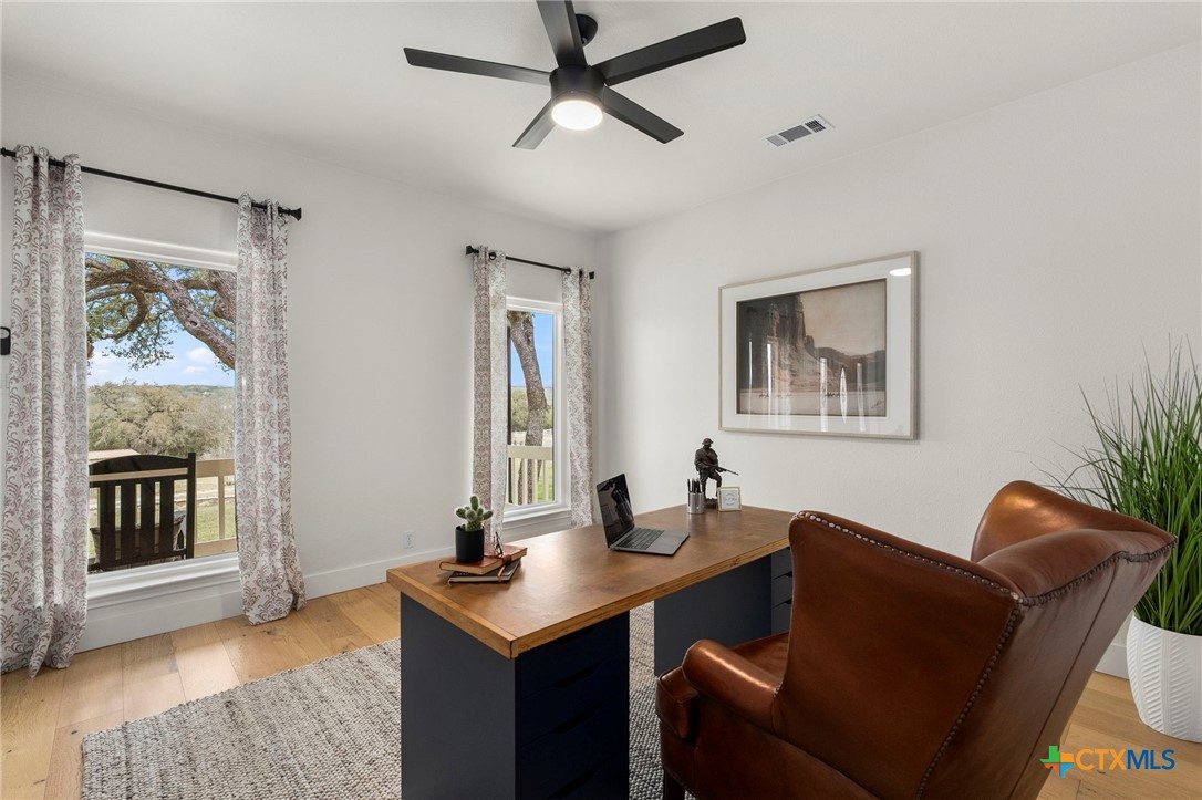 1130 Stoney Ridge Road Bulverde, TX 78163 - Photo 18 of 42 a living room with furniture and a window