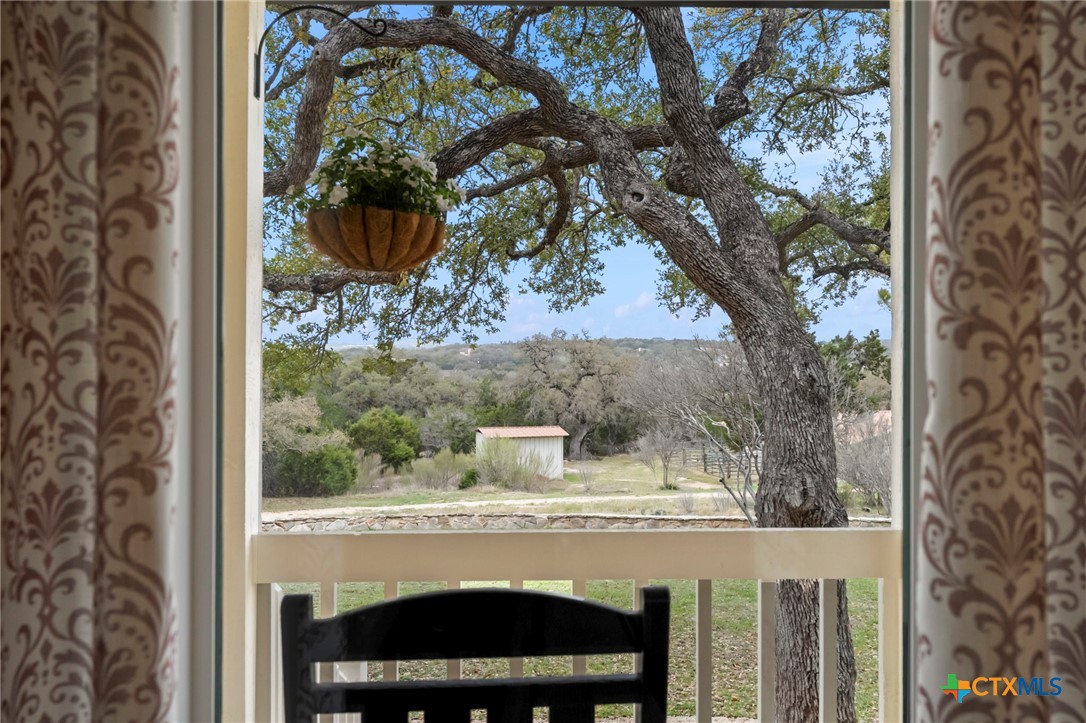 1130 Stoney Ridge Road Bulverde, TX 78163 - Photo 19 of 42 a view of fountain in the balcony