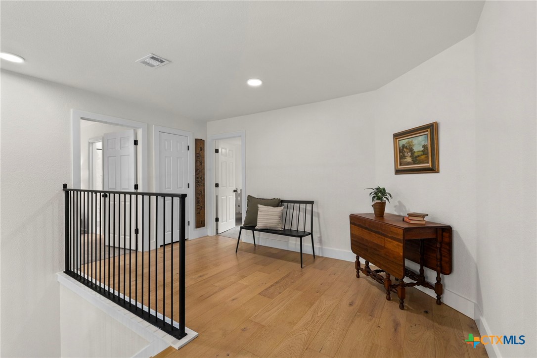 1130 Stoney Ridge Road Bulverde, TX 78163 - Photo 25 of 42 a view of a workspace with furniture and a window
