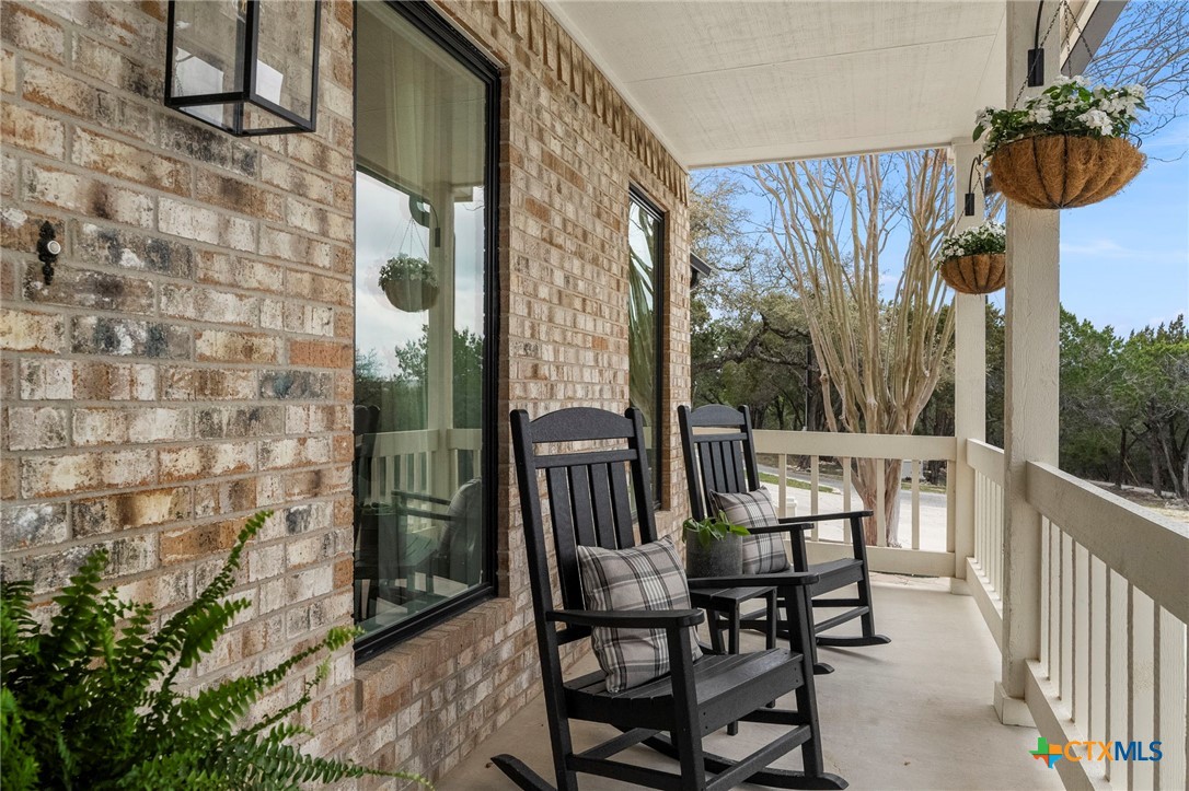 1130 Stoney Ridge Road Bulverde, TX 78163 - Photo 34 of 42 a view of a chairs and table in the balcony