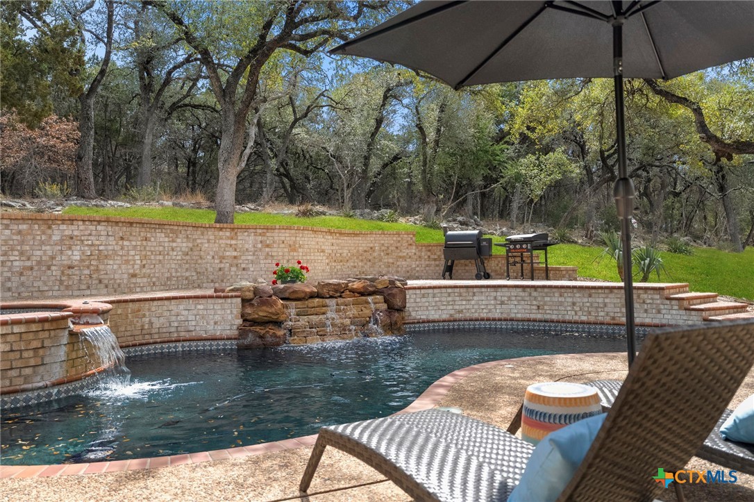 1130 Stoney Ridge Road Bulverde, TX 78163 - Photo 38 of 42 a view of swimming pool with a patio