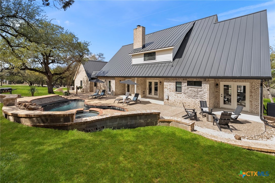 1130 Stoney Ridge Road Bulverde, TX 78163 - Photo 40 of 42 a front view of a house with swimming pool having outdoor seating