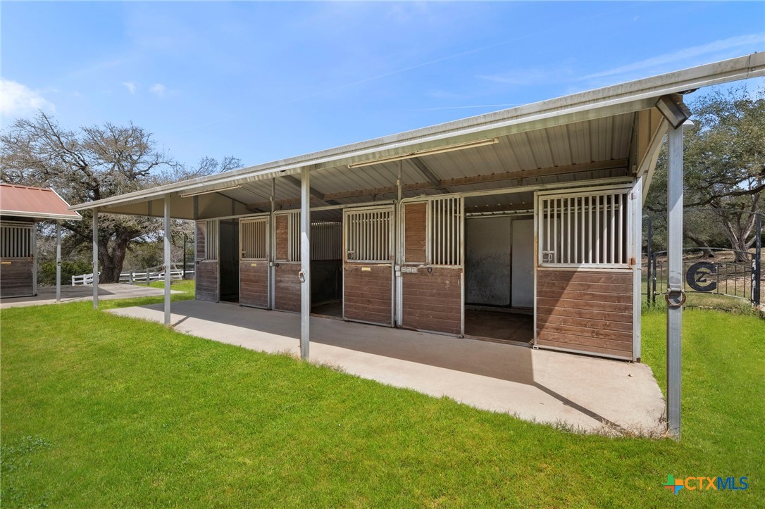 1130 Stoney Ridge Road Bulverde, TX 78163 - Photo 41 of 42 a view of a house with a backyard