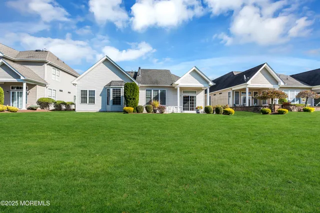 a view of a livingroom with furniture and a window