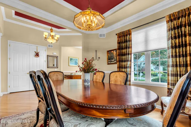 a kitchen with stainless steel appliances granite countertop a sink refrigerator and cabinets