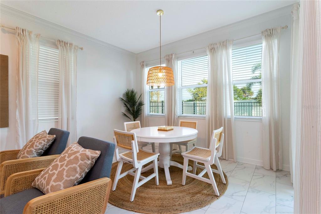 445 Strand Drive Melbourne Beach, FL 32951 - Photo 23 of 99 a dining room with furniture and window