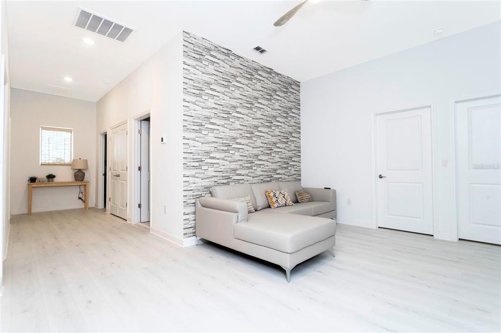 445 Strand Drive Melbourne Beach, FL 32951 - Photo 28 of 99 a living room with furniture and a bathroom