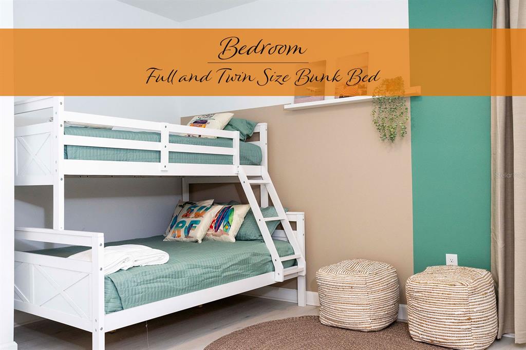 445 Strand Drive Melbourne Beach, FL 32951 - Photo 30 of 99 a bedroom with a bed and wooden floor