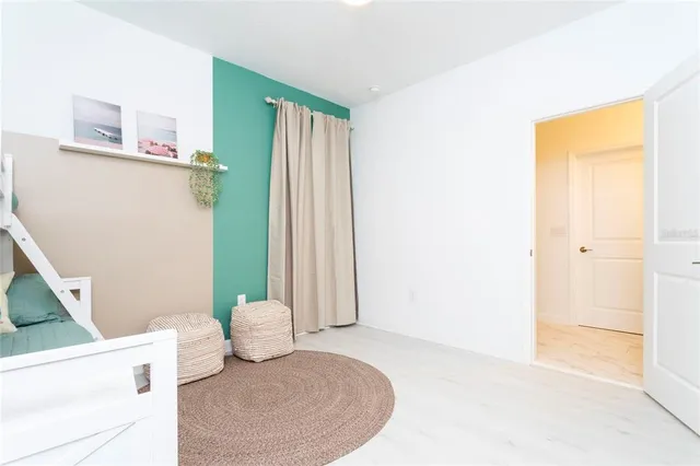 a bedroom with a bed and a dresser