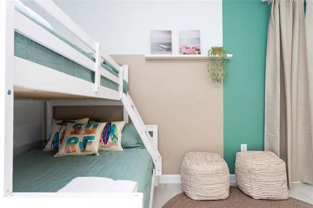 a bathroom with a toilet a sink a tub and mirror