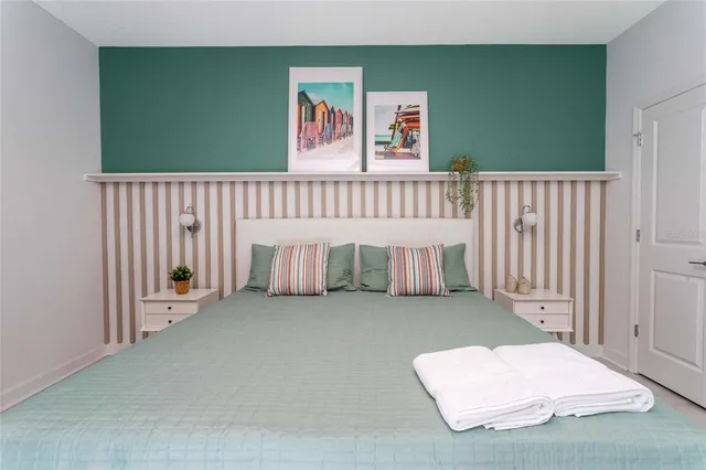 a room with a chair and a chandelier