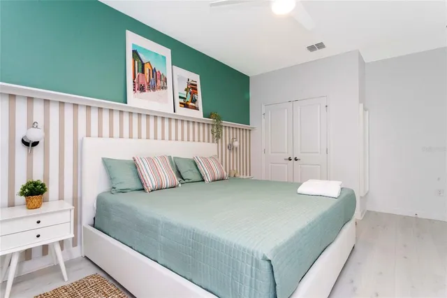 a bedroom with a bed and a table in it