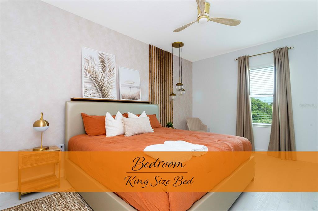 445 Strand Drive Melbourne Beach, FL 32951 - Photo 43 of 99 a bedroom with a bed and window