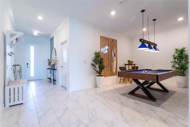 a kitchen with stainless steel appliances a refrigerator sink and cabinets
