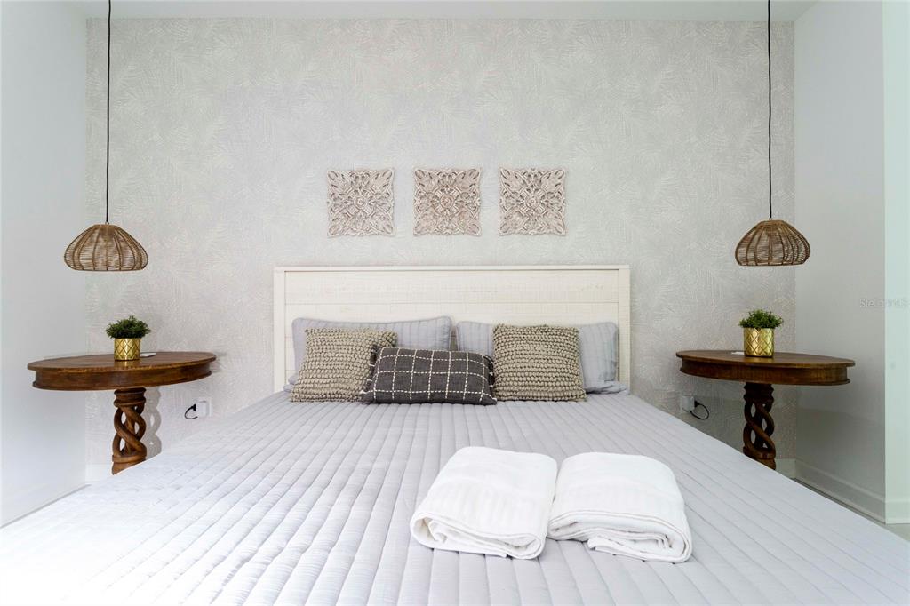 445 Strand Drive Melbourne Beach, FL 32951 - Photo 80 of 99 a room with a chair and a chandelier