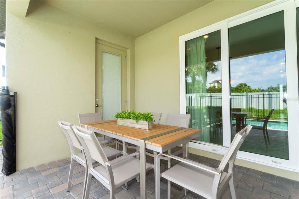 445 Strand Drive Melbourne Beach, FL 32951 - Photo 89 of 99 a view of an outdoor dining space with furniture