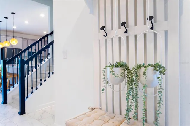 a living room with furniture and a bathroom