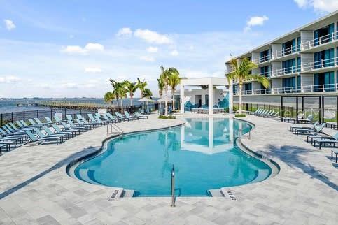 445 Strand Drive Melbourne Beach, FL 32951 - Photo 96 of 99 a view of a swimming pool with a patio