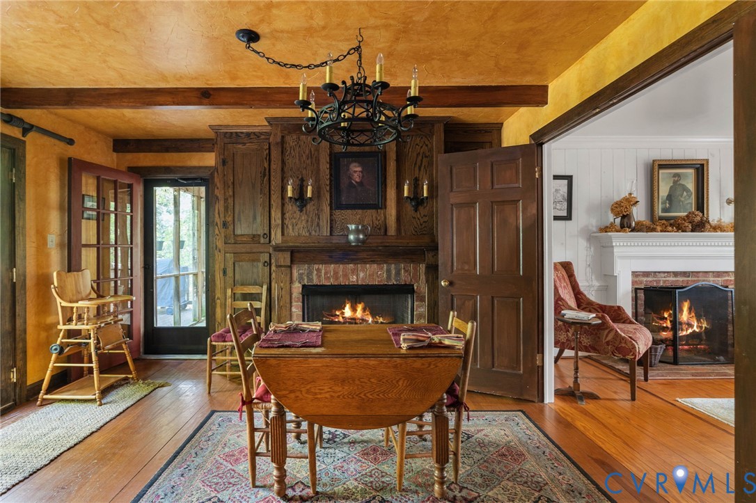 7381 McClellan Road Mechanicsville, VA 23111 - Photo 26 of 66 Dining room with a prominent brick fireplace featu