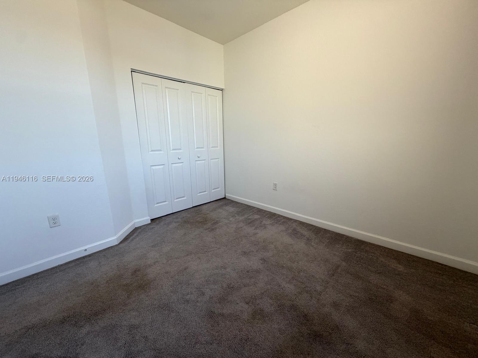 3326 West 112th Street Hialeah, FL 33018 - Photo 12 of 37 an empty room with a empty space