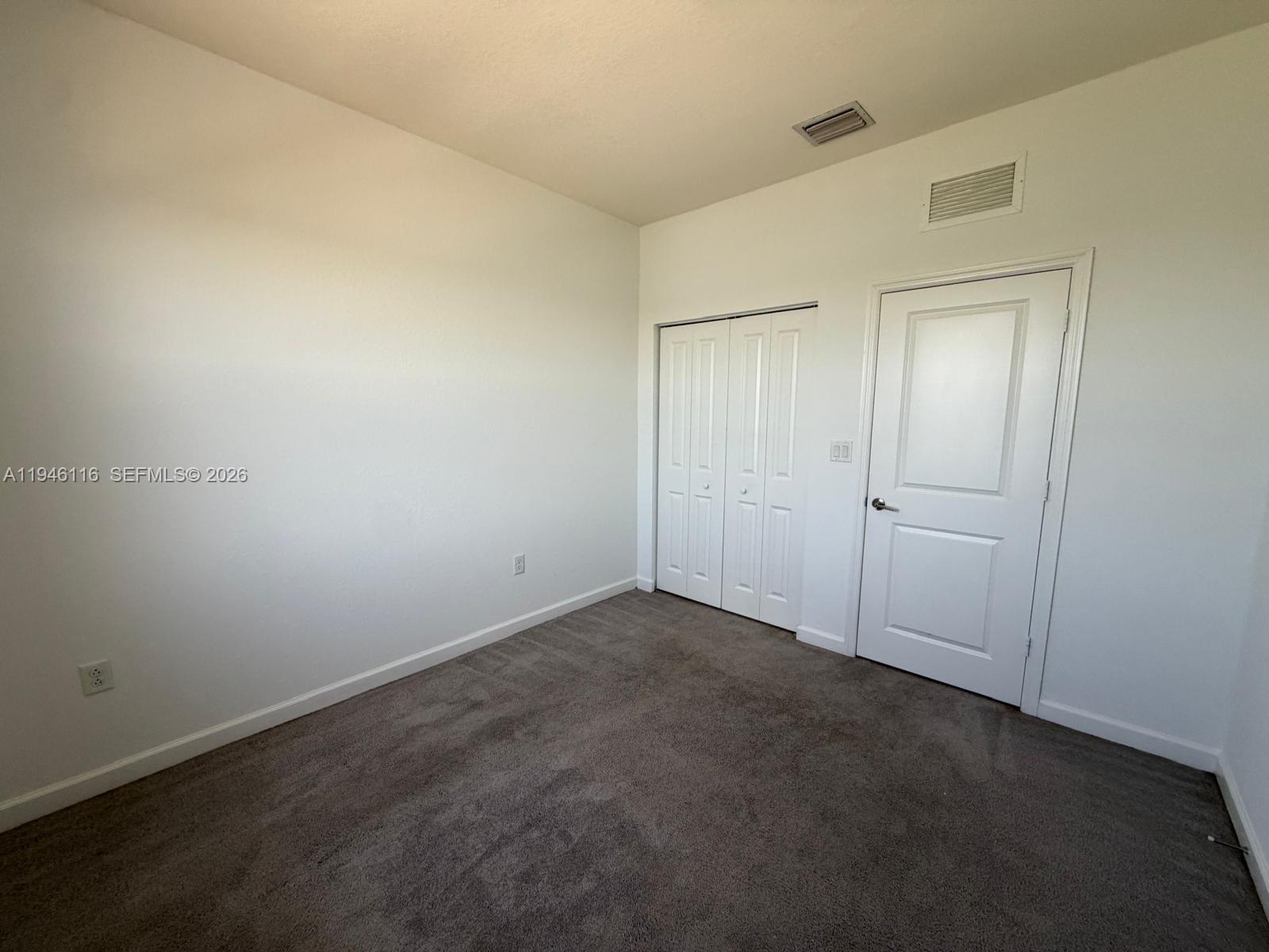 3326 West 112th Street Hialeah, FL 33018 - Photo 14 of 37 an empty room with closet area