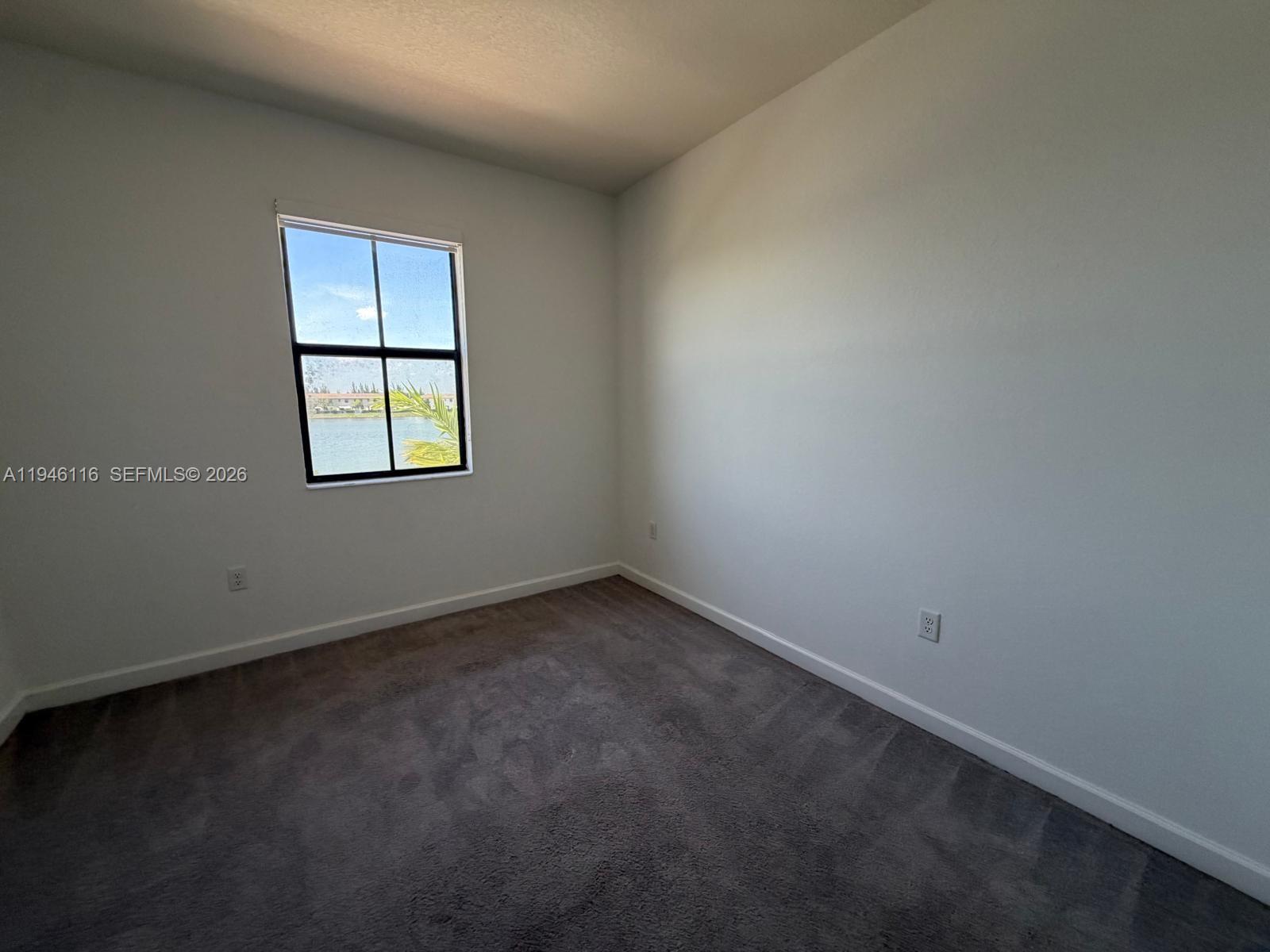 3326 West 112th Street Hialeah, FL 33018 - Photo 15 of 37 an empty room with a window