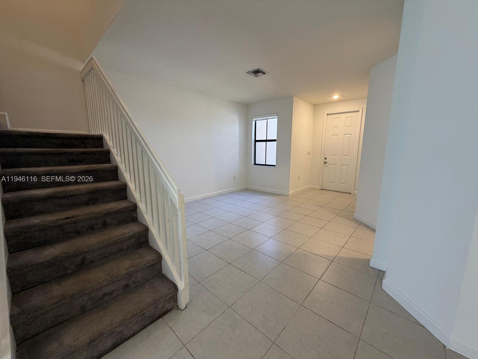 3326 West 112th Street Hialeah, FL 33018 - Photo 17 of 37 a view of an entryway with stairs