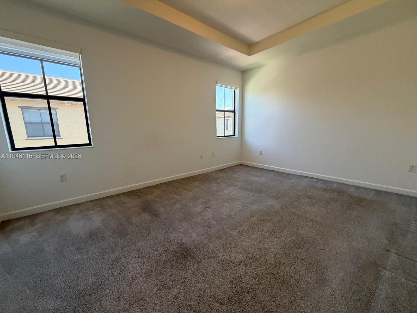 3326 West 112th Street Hialeah, FL 33018 - Photo 20 of 37 an empty room with windows and closet